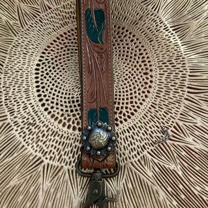 Brown and Green Leather Strap with Decorative Medallion